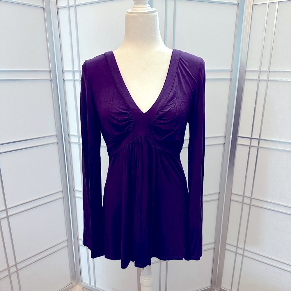 Beautiful deep eggplant color. Flattering for all body types. Size M
